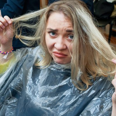 Unhappy,Young,Woman,With,Bad,Hair,At,Barber,Shop.